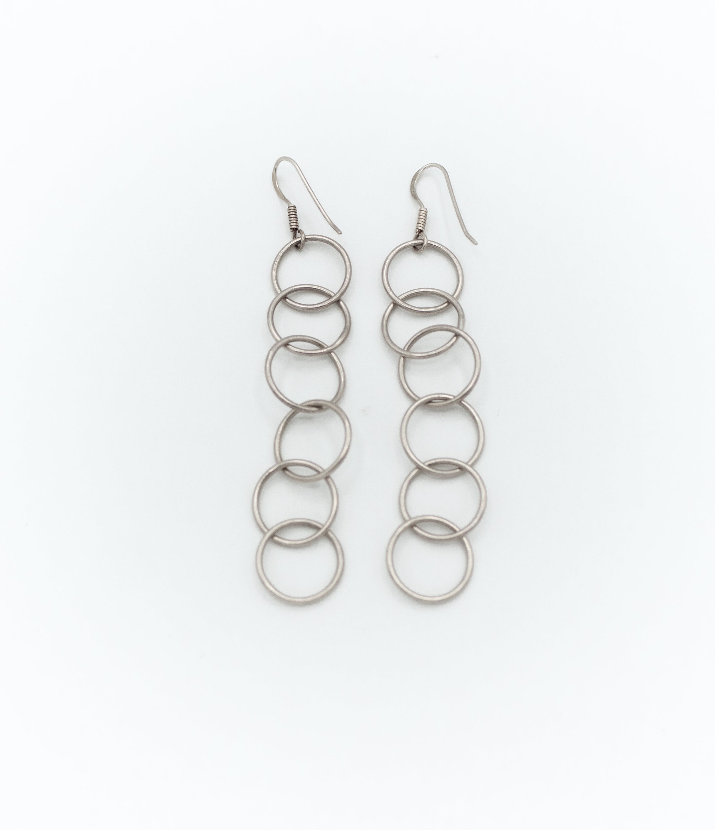 Dangle earrings with interlocked rings