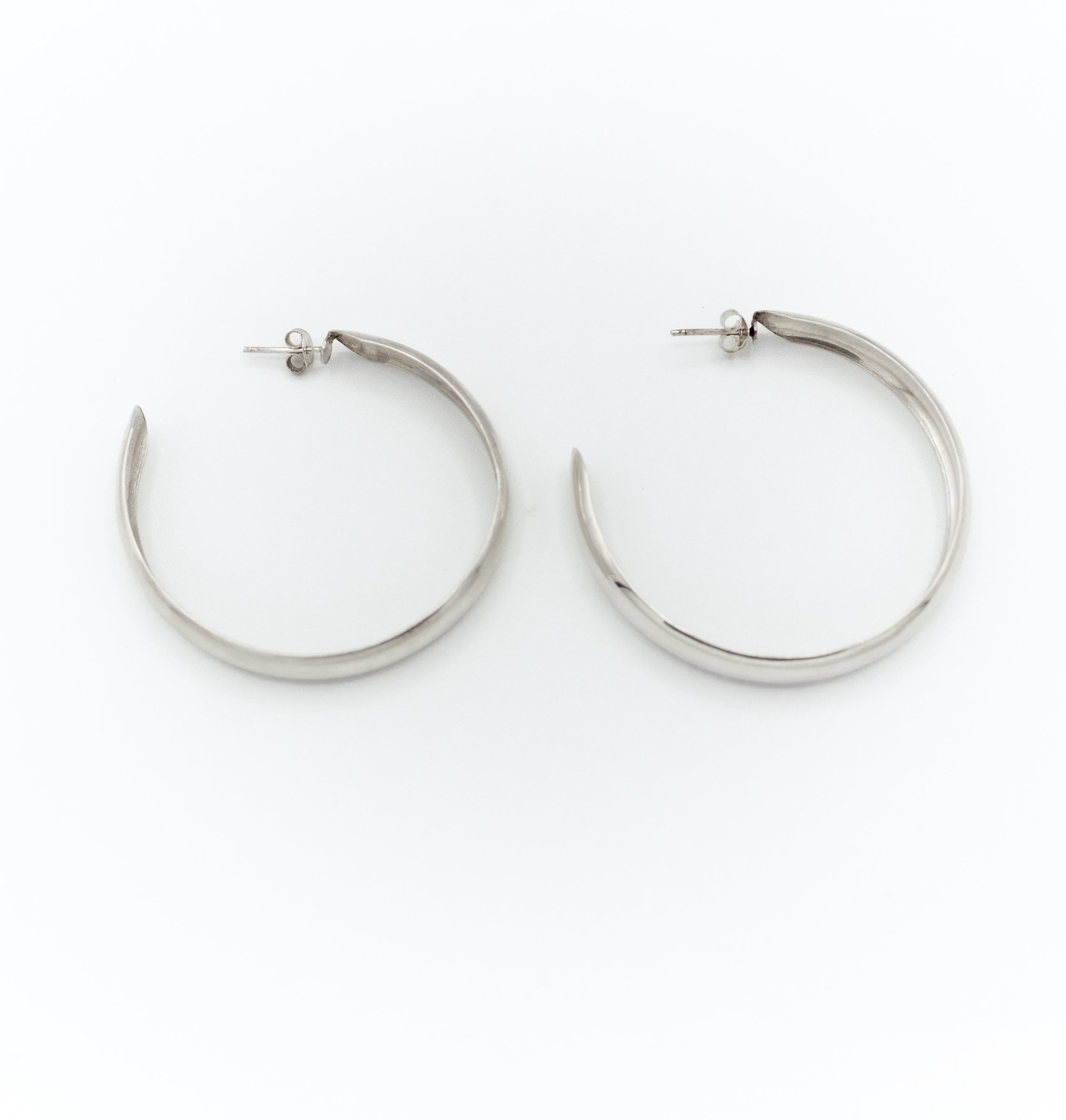 Wide flat open hoop earrings
