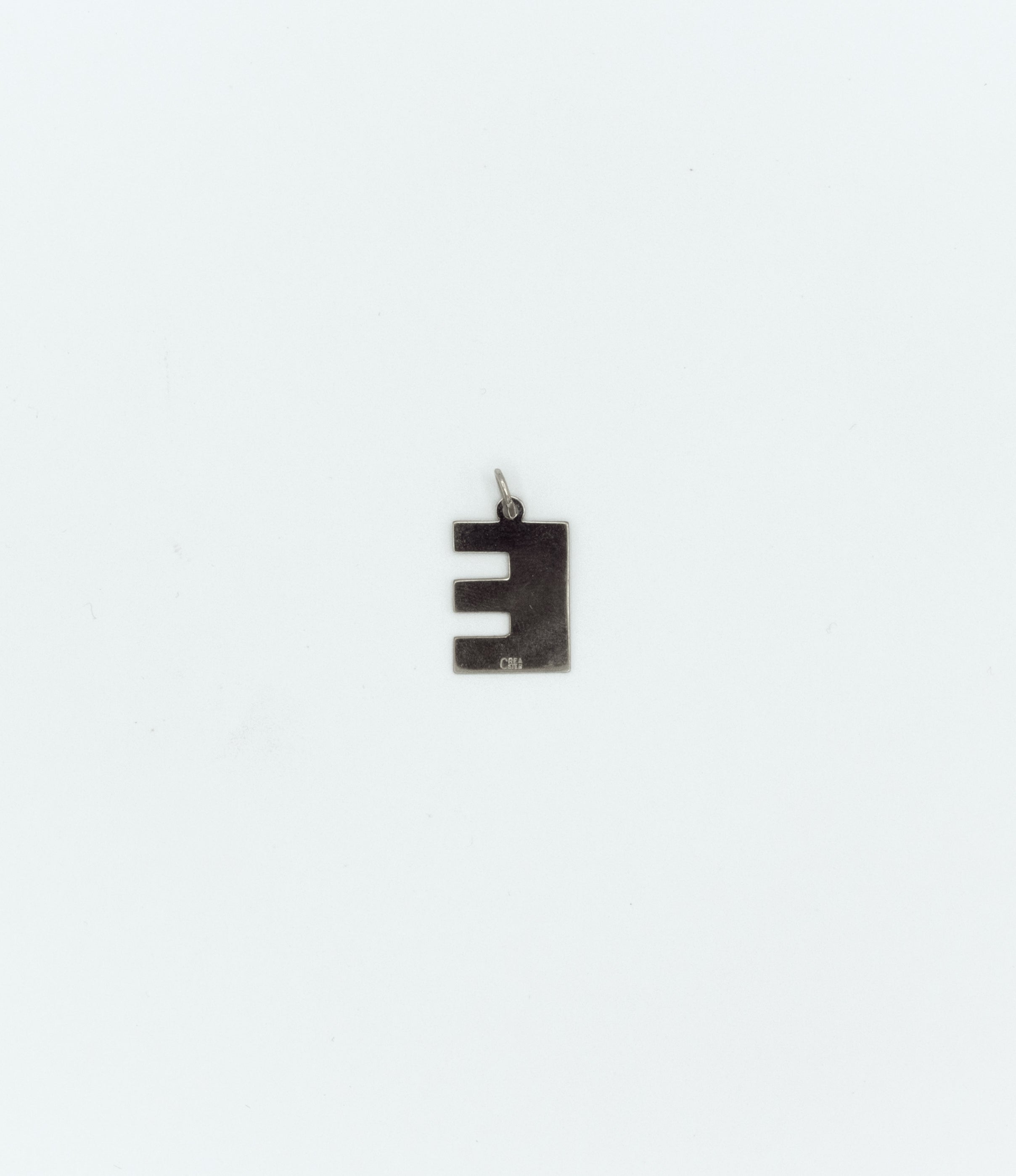 Textured letter ‘’E’’ pendant